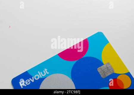 A close up photo of the Revolut Junior bank card on a white background. Stock Photo