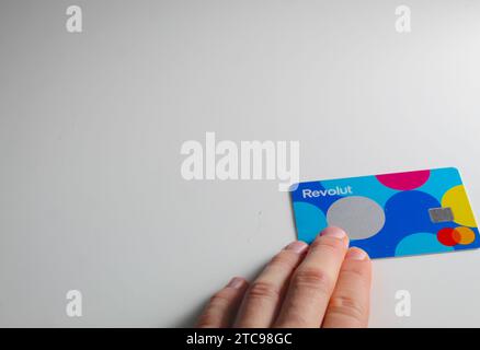 A close up photo of the Revolut Junior bank card on a white background. Stock Photo