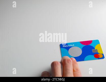 A close up photo of the Revolut Junior bank card on a white background. Stock Photo