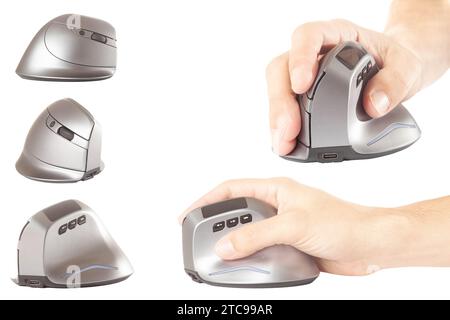 Close-up of male hand clicking on vertical computer mouse. Isolated vertical mouse. Concept of body health. Office syndrome concept. Carpal Tunnel Syn Stock Photo