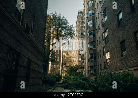 NEW YORK CITY, USA - JULE 13th, 2023 A small courtyard between the skyscrapers. High quality photo Stock Photo