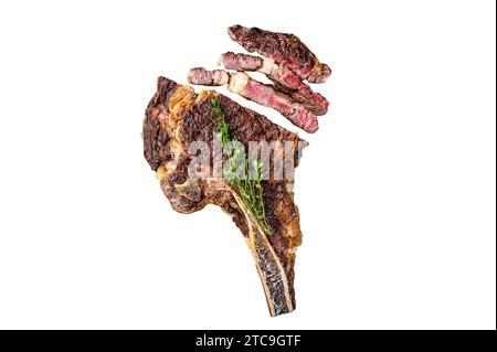 Dry aged grilled Tomahawk or cowboy beef meat steak on a meat cleaver. Isolated, white background Stock Photo