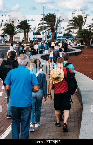 Lanzarote, Spain - November 25, 2023: Tourists walking towards the town centre in Arrecife de Lanzarote, Spain Stock Photo