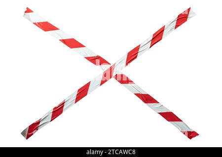 X shape made from red and white barricade tape on white background with clipping path Stock Photo
