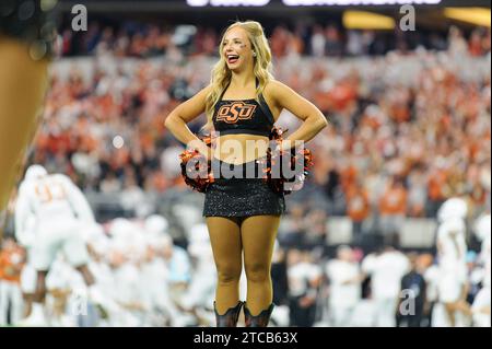 Arlington, Texas, USA. 2nd Dec, 2023. Oklahoma State Cowboys cheerleader before the NCAA Football game between the Oklahoma State Cowboys and Texas Longhorns at AT&T Stadium in Arlington, Texas. Matthew Lynch/CSM/Alamy Live News Stock Photo