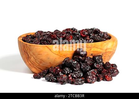 Dried cranberries in a wooden bowl Stock Photo