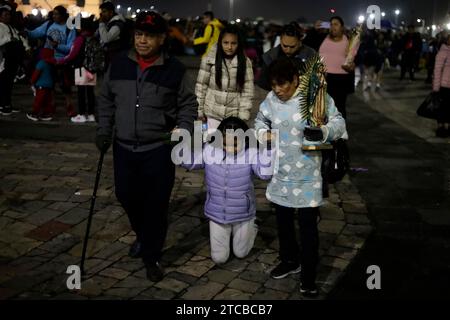 Mexico City, Mexico. 11th Dec, 2023. Parishioners pay a gift to the Virgin of Guadalupe at the celebration of the 492nd anniversary of her appearance on Tepeyac Hill in Mexico City. on December 11, 2023 in Mexico City, Mexico (Credit Image: © Luis Barron/eyepix via ZUMA Press Wire) EDITORIAL USAGE ONLY! Not for Commercial USAGE! Credit: ZUMA Press, Inc./Alamy Live News Stock Photo