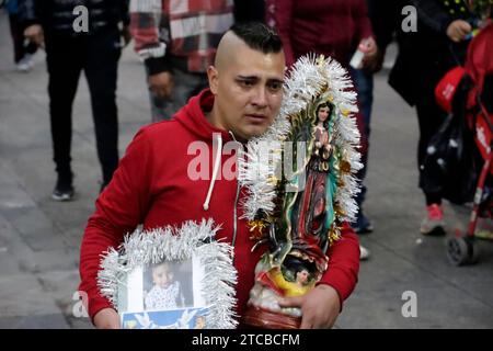 Mexico City, Mexico. 11th Dec, 2023. December 11, 2023, Mexico City, Mexico: Parishioners pay a gift to the Virgin of Guadalupe at the celebration of the 492nd anniversary of her appearance on Tepeyac Hill in Mexico City. on December 11, 2023 in Mexico City, Mexico (Photo by Luis Barron/Eyepix Group/Sipa USA). Credit: Sipa USA/Alamy Live News Stock Photo