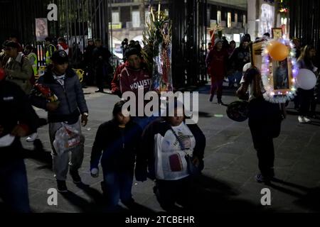 Mexico City, Mexico. 11th Dec, 2023. December 11, 2023, Mexico City, Mexico: Parishioners pay a gift to the Virgin of Guadalupe at the celebration of the 492nd anniversary of her appearance on Tepeyac Hill in Mexico City. on December 11, 2023 in Mexico City, Mexico (Photo by Luis Barron/Eyepix Group/Sipa USA). Credit: Sipa USA/Alamy Live News Stock Photo