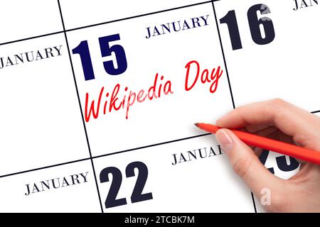 January 15. Hand writing text Wikipedia Day on calendar date. Save the date. Holiday.  Day of the year concept. Stock Photo