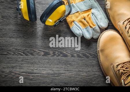 Composition of the safety workwear on wooden panel Stock Photo