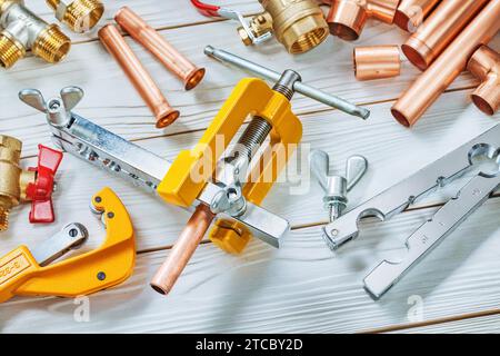 Flare tube tool set or these clamps Brake Plumper Schneider fittings Fittings on wooden boards Stock Photo