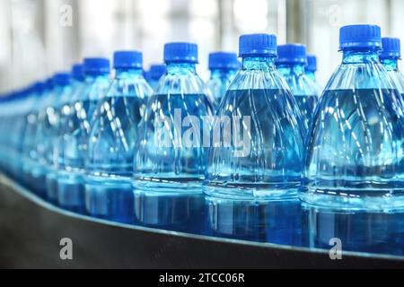 Closeup on mineral water green bottles in raw and lines Stock Photo