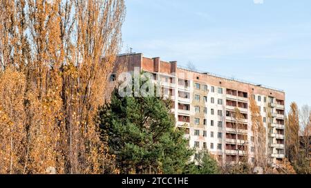 Old empty big house on the street of the abandoned city Chernobyl Ukraine in autumn Stock Photo