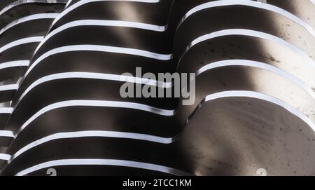 Abstract background smooth curved lines metal construction close up Stock Photo