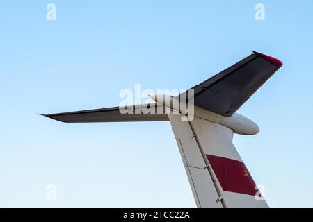 Part tail of a soviet airliner close up isolated on a blue sky background Stock Photo