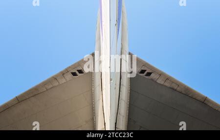 Fragment of airplane wings on a background of blue sky isolated background Stock Photo