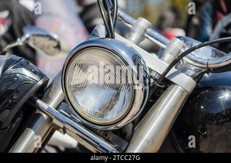 Chrome shiny chopper motorcycle headlight close up Stock Photo