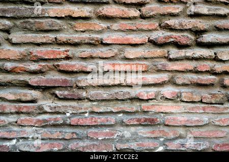 Pattern texture of old vintage orange brick wall detailed background close up Stock Photo