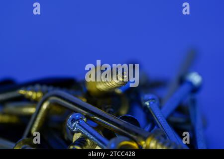 A colorful mix of nails and screws with eyelets and hoes Stock Photo