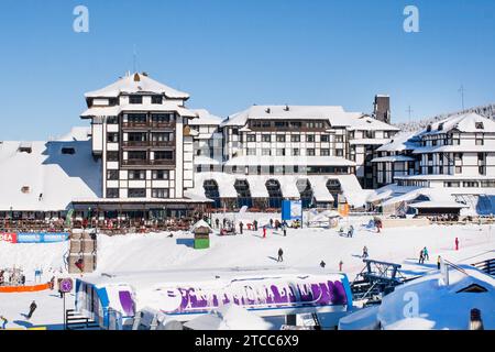 Kopaonik, Serbia, January 22, 2016: Panorama of ski resort Kopaonik, Serbia, hotels, restaurants, people walking and skiing, mountains view in winter Stock Photo