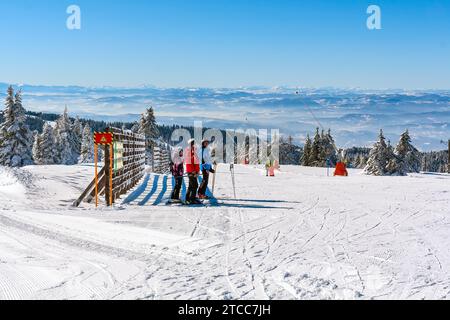 Kopaonik, Serbia, January 20, 2016: Ski resort panoramic view, ski slope, people skiing down the hill, mountains panorama Stock Photo