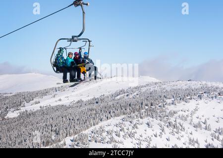 Kopaonik, Serbia, January 22, 2016: Skiers arriving to the station on the ski lift Stock Photo