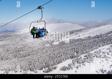 Kopaonik, Serbia, January 22, 2016: Skiers arriving to the station on the ski lift Stock Photo