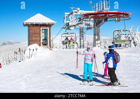 Kopaonik, Serbia, January 22, 2016: Ski resort Kopaonik, Serbia, ski lift, ski slope, people skiing down from the lift Stock Photo