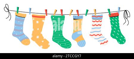Baby socks with textures and patterns on clothes line. Vector illustration. Stock Vector