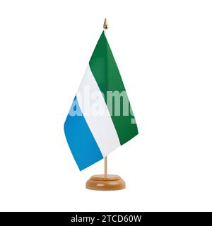 Small national flags of the Sierra Leone on a light blurry background ...