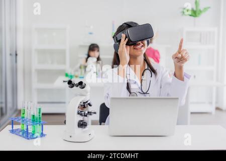 Student using VR glasses headset technology for help visual learning education science class room in modern school Stock Photo