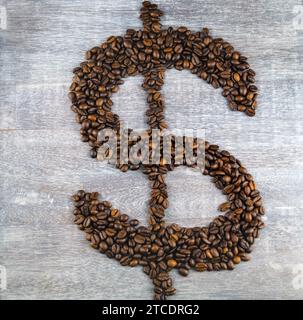 Dollar sign, formed with roasted coffee beans, coffee price Stock Photo