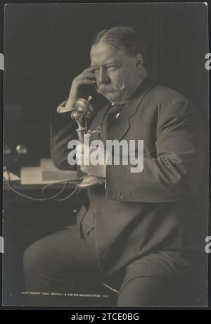 William Howard Taft, three-quarter-length portrait, seated, facing left, talking on a telephone as he receives news about his nomination as the 1908 Republican presidential candidate from Stock Photo