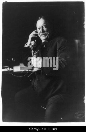 William Howard Taft, three-quarter-length portrait, seated facing left, on telephone) Stock Photo