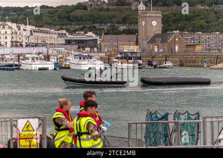 Migrants arriving,Port of Dover, Kent, Britain. 1st June 2022. The Royal Navy tow aninflatable raft into Dover which  were intercepted crossing the En Stock Photo