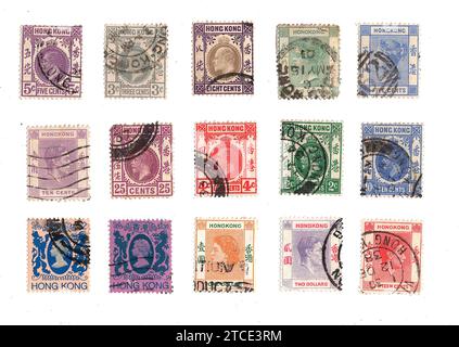 A set of vintage postage stamps from Hong Kong featuring various UK monarchs isolated on a white background. Stock Photo