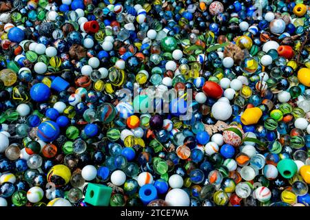 Schollevaar, Netherlands, Marbles & Taw's on a young boy's grave, left there after his burrial. Stock Photo