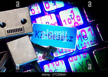 FOTOMONTAGE, Taste mit Aufschrift KI-Gesetz mit Roboter auf einer Computertastatur *** PHOTOMONTAGE, button with inscription AI law with robot on a computer keyboard Stock Photo