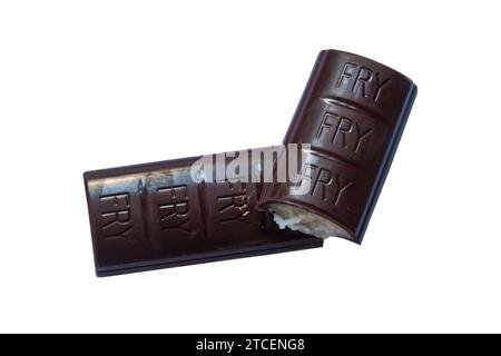 Bar of Chocolate Cream by Frys removed from wrapper and broken to see filling isolated on white background - chocolate with a fondant centre Stock Photo