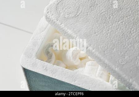 Box with white foam  foam to protect product , care shipping product , Stock Photo