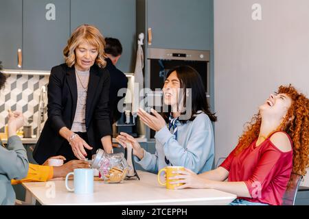 Business people having fun together during a coffee break at the office. Business concept. Stock Photo