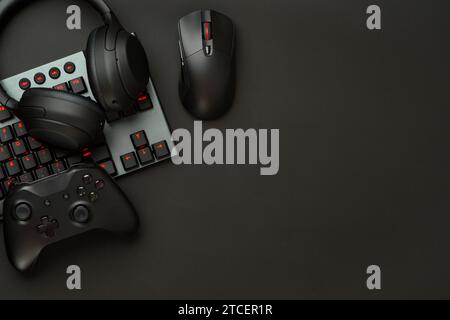 Gaming concept on black background with computer keyboard and joystick Stock Photo