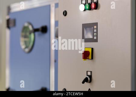 Switchboard of modern automated industrial equipment. Industrial control panel. Selective focus. Stock Photo