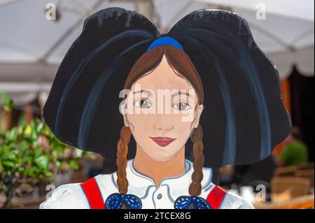 Wooden figure of woman in traditional costume, Obernai, Alsace, France, Europe Stock Photo