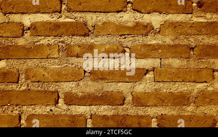 Dark golden brown grunge brick wall for background Stock Photo
