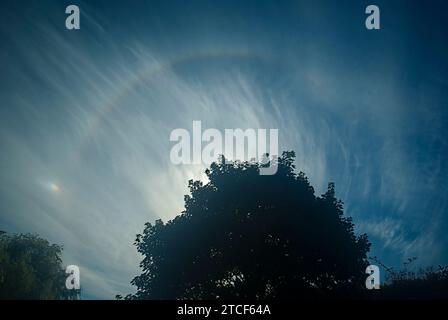 Solar Halo with sun dog caused by ice crystals in the upper atmosphere seen from northern England. Stock Photo