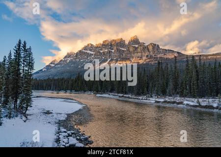 Scenic Castle Mountain with river reflections at sunset Stock Photo