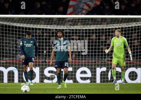 EINDHOVEN - (lr) William Saliba of Arsenal FC,. Mohamed Elneny of Arsenal FC, Arsenal FC goalkeeper Aaron Ramsdale during the UEFA Champions League Group B match between PSV Eindhoven and Arsenal FC at Phillips Stadium on December 12, 2023 in Eindhoven, Netherlands. ANP | Hollandse Hoogte | Bart Stoutjesdijk Stock Photo