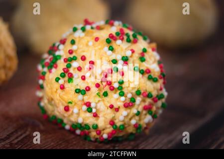 Christmas coconut balls  with red and green decoration candies - close-up Stock Photo